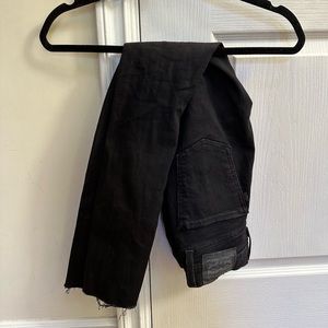 Levi’s black mile high super skinny high waisted ripped jeans